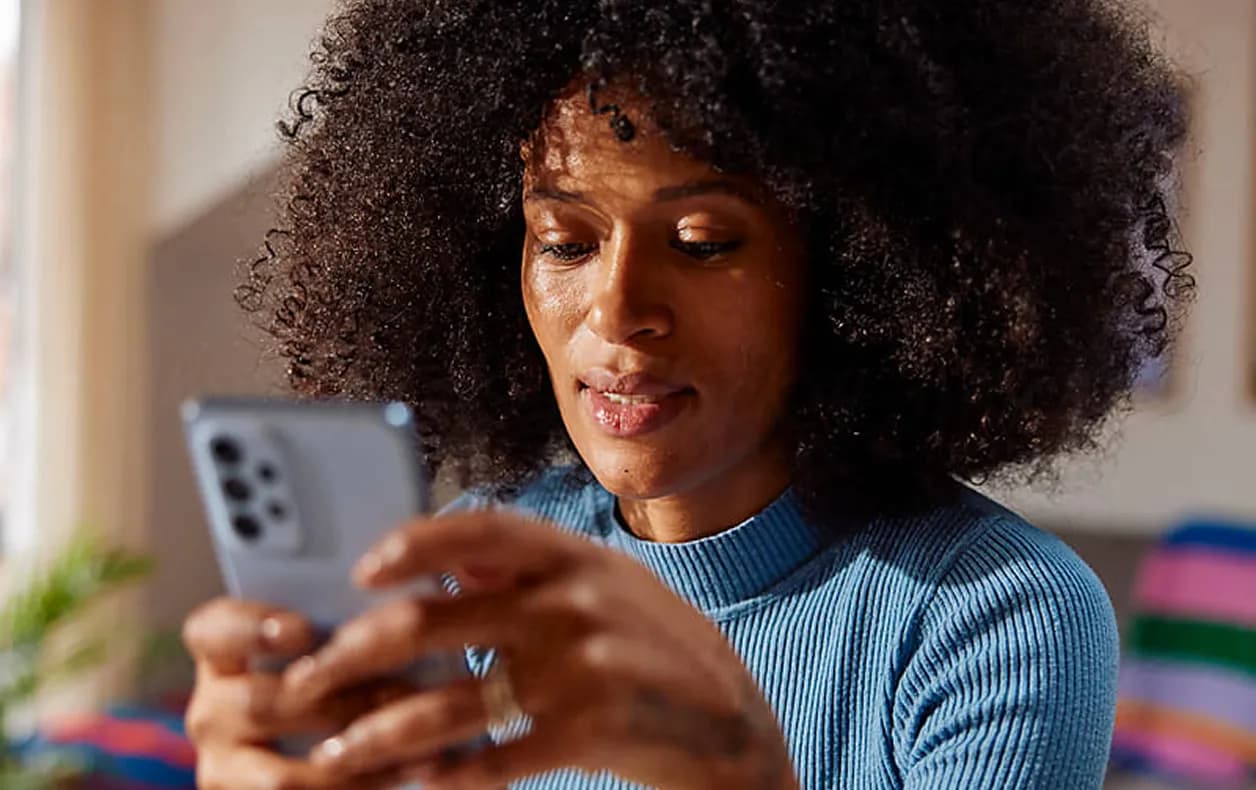 Person checking their background check results on their phone